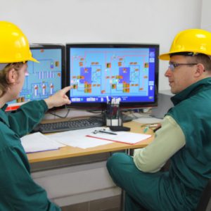 Industrial workers in control room